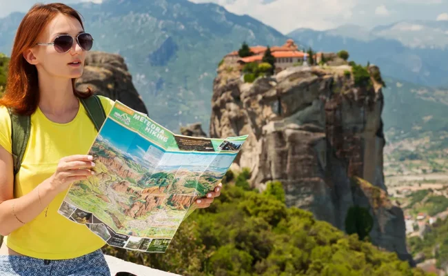 beautiful tourist greece with meteora monasteries background