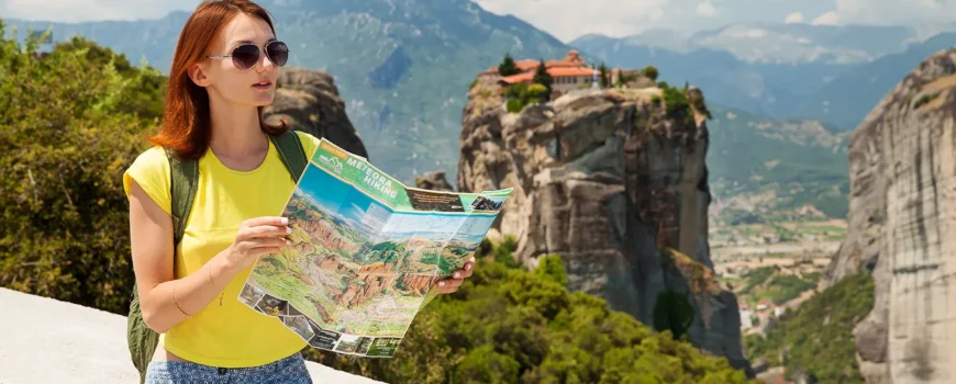 beautiful tourist greece with meteora monasteries background